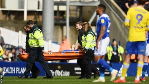 Maikel Kieftenbeld is stretchered off the field after suffering the knee injury in the second half of Birmingham City's win against Leeds United