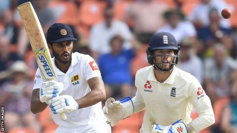 Sri Lanka batsman Roshen Silva watches the ball after playing a shot, with England wicketkeeper Ben Foakes behind him
