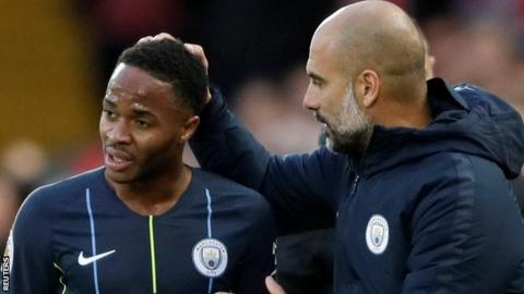 Manchester City manager Pep Guardiola (right) and forward Raheem Sterling