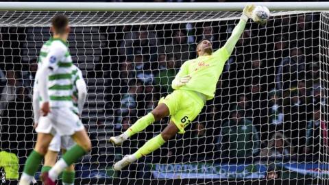 Fraser Forster saves from Ryan Jack in the first half
