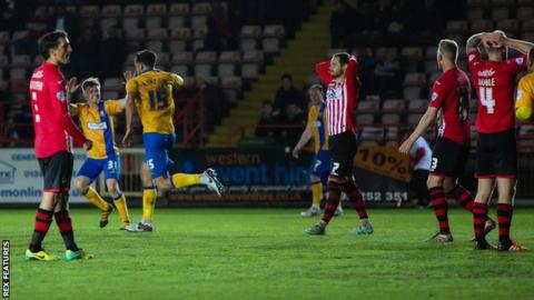 Mansfield's Ryan Tafazolli celebrates his 82nd minute winner
