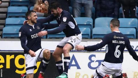 Lee Gregory celebrates on one knee after scoring against Nottingham Forest