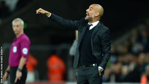 Guardiola gives instructions whilst at the Liberty Stadium last season