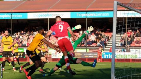 Ollie Palmer bundles home Crawley Town's third goal