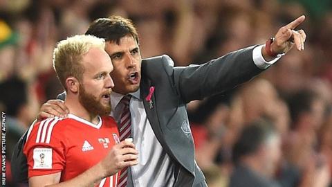 Jonny Williams receives instructions from Wales manager Chris Coleman