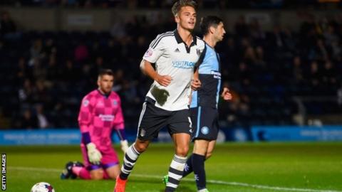 Alex Kacaniklic celebrates