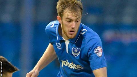 Matt Clarke: Ipswich Town defender extends Portsmouth loan - BBC Sport