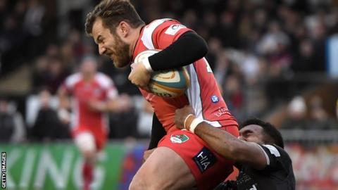 James Stokes is tackled by a Newcastle Falcons player