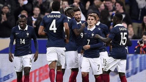 France team celebrate during a friendly with Germany