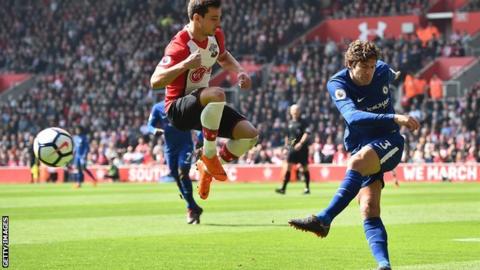 Chelsea defender Marcos Alonso (right) plays a ball past Southampton defender Cedric Soares