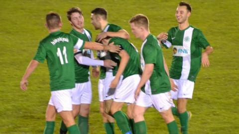 Charlie Laine is congratulated by his team-mates after scoring the opener