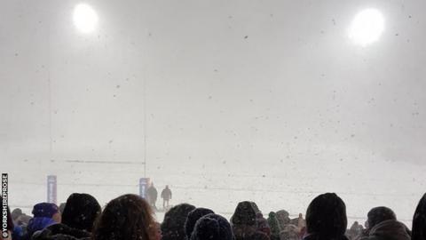 Snow continued to fall heavily during the course of the game, leading to postponement