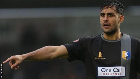 Ryan Tafazolli in action for Mansfield Town