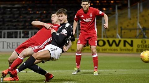 Aberdeen's Scott McKenna (left) deflects the ball into the net