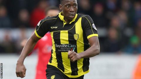 Burton's Lucas Akins in action