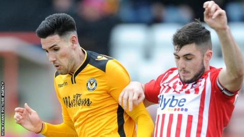 Newport's Conor Wilkinson (left) competes with Jordan Moore-Taylor of Exeter