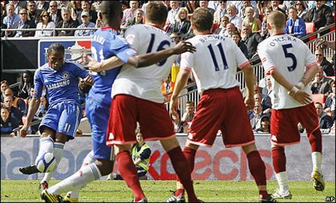 Dider Drogba tucks in the free-kick
