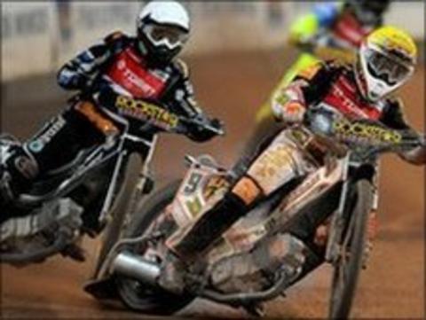 Speedway riders in action