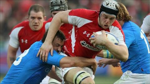 Valerio Bernabo of Italy tackles Ryan Jones of Wales