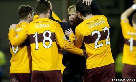 Motherwell manager Stuart McCall congratulates his players