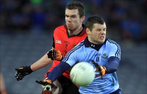 Down's Declan Rooney and Dublin's Kevin McManamon