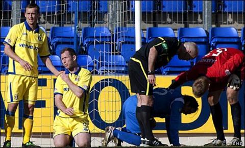 Frazer Wright and Danny Invincibile lie injured at McDiarmid Park