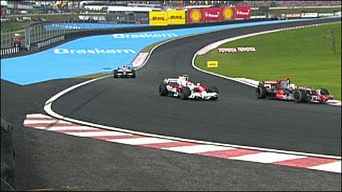 Lewis Hamilton gets past Timo Glock