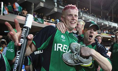 Kevin O'Brien and his brother Niall celebrate after the win over England