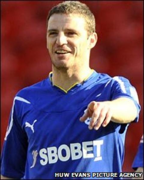 Jason Koumas celebrates a goal