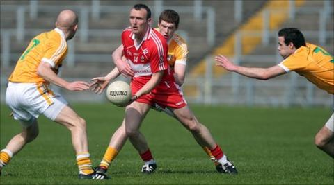 Derry forward Paddy Bradley is surrounded at Casement Park