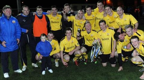 Glenavon boss Marty Quinn (left) celebrates the victory with his team