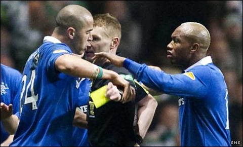 Madjid Bougherra and El Hadji Diouf surround referee Calum Murray