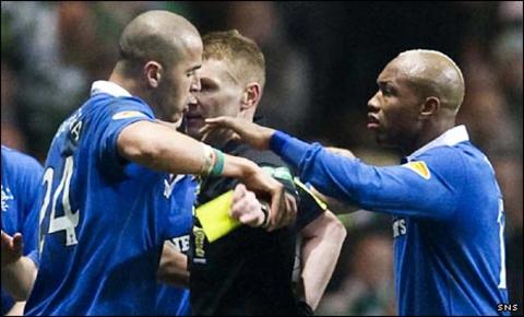 Madjid Bougherra (left) attempts to prevent referee Calum Murray issuing a yellow card
