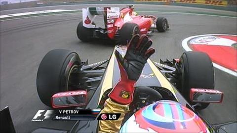 Renault's Vitali Petrov gets upset with Ferrari's Felipe Massa