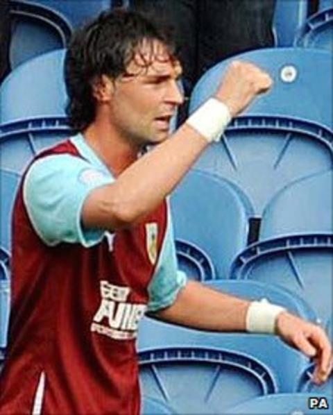 Chris Eagles celebrates after his penalty gives Burnley victory