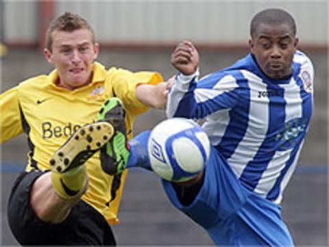 Glenavon's Jay Magee in action against Leon Knight of Coleraine
