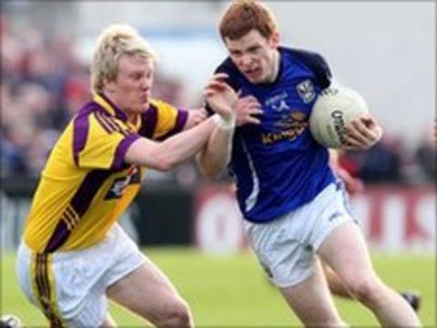 Sean Gaule tackles Cavan's Niall McDermott in the semi-final