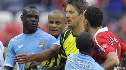 Man Utd defender Rio Ferdinand (right) confronted Man City striker Mario Balotelli at the final whistle