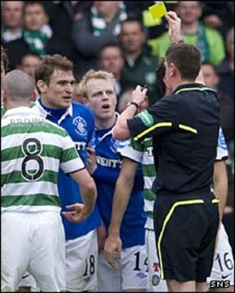 Craig Thomson shows Nikica Jelavic a yellow card