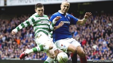 Gary Hooper of Celtic and Madjid Bougherra battle for possession