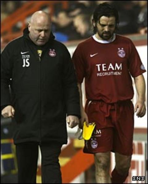 Paul Hartley goes off injured against St Mirren