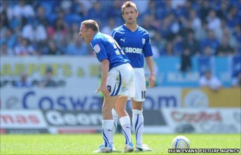 Craig Bellamy bellow orders against QPR as Stephen McPhail looks on