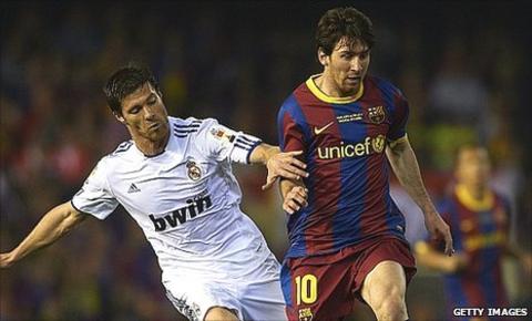 Xabi Alonso (left) and Lionel Messi