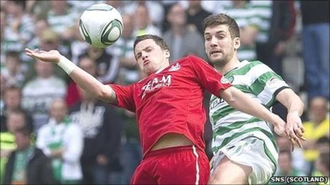 Celtic's Charlie Mulgrew challenges former Aberdeen team-mate Chris Maguire for the ball
