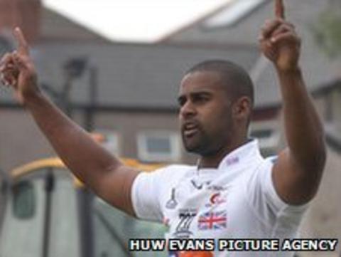 Dragons wing Aled Brew celebrates scoring against the Blues