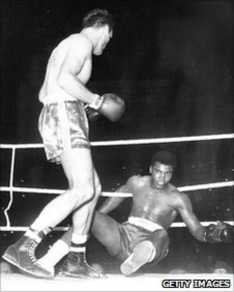 Henry Cooper (left) standing over the felled Cassius Clay