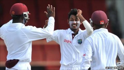 Devendra Bishoo celebrates taking a wicket