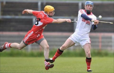 Derry's Martin Gorgan and Tyrone's Paddy Kelly