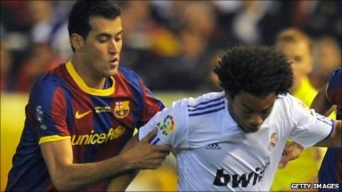 Barcelona's Sergio Busquets and Real Madrid's Marcelo during the Spanish Cup final