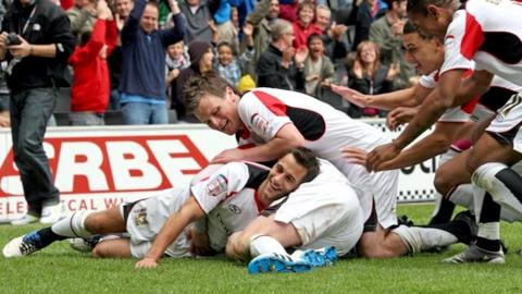 MK Dons celebrate Sam Baldock's goal